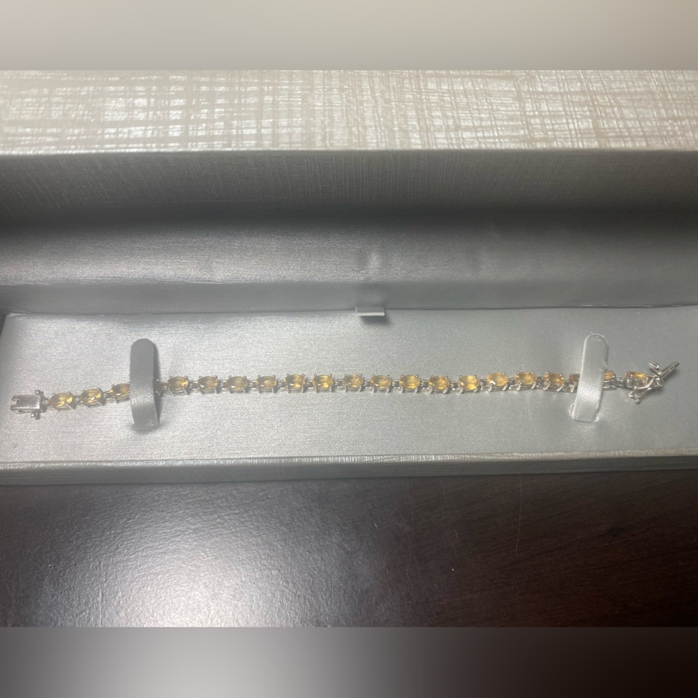 Silver and Topaz tennis bracelet. November birthstone. Barely worn.